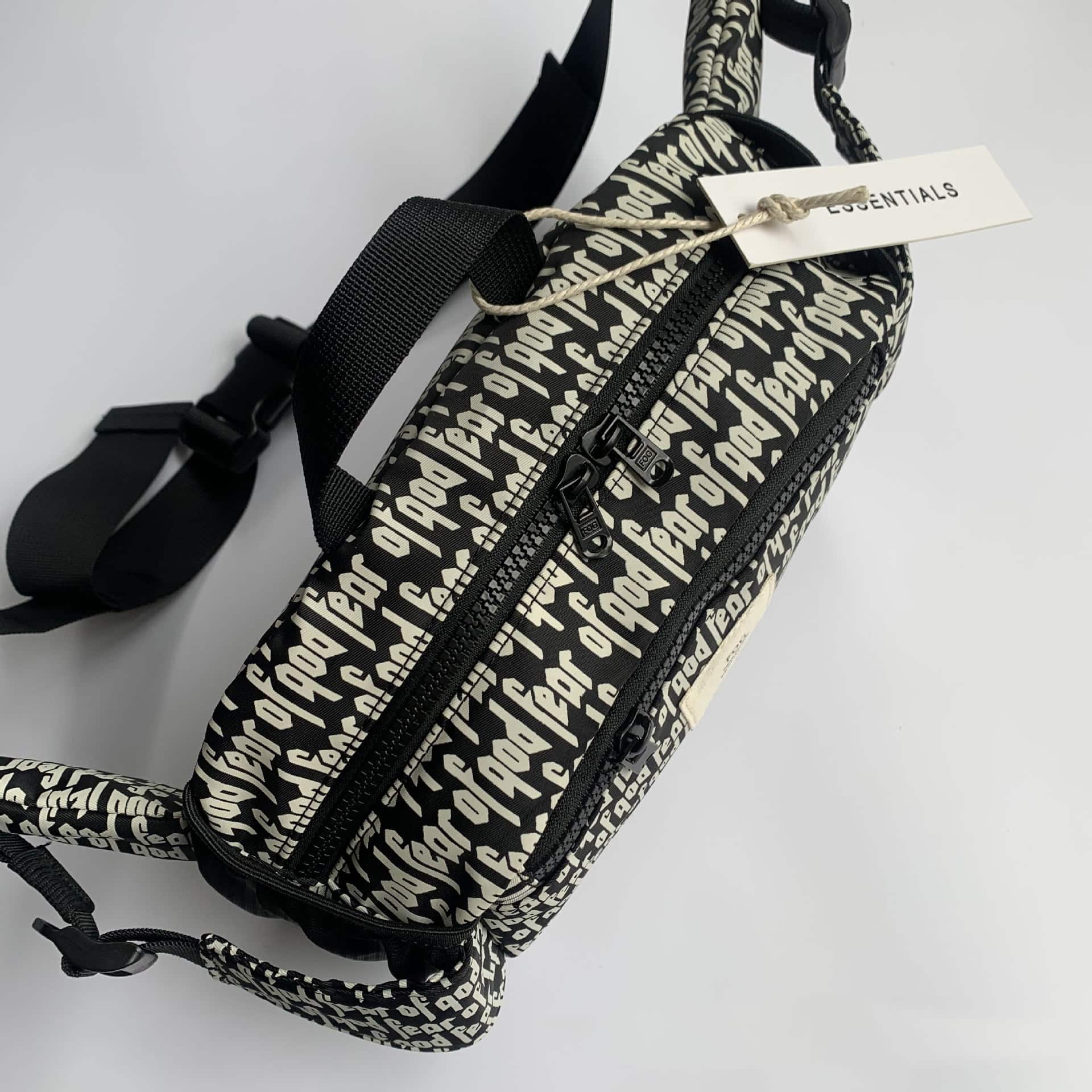 Black and white printed backpack featuring "twice kpop merch" design, with multiple compartments and adjustable straps. Perfect for fans to showcase their love for TWICE and K-pop culture.