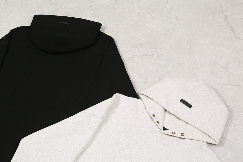 Black and white hoodie and sweatshirt with button details, perfect for K-pop fans and merchandise collection; stylish apparel for K-pop enthusiasts and collectors.