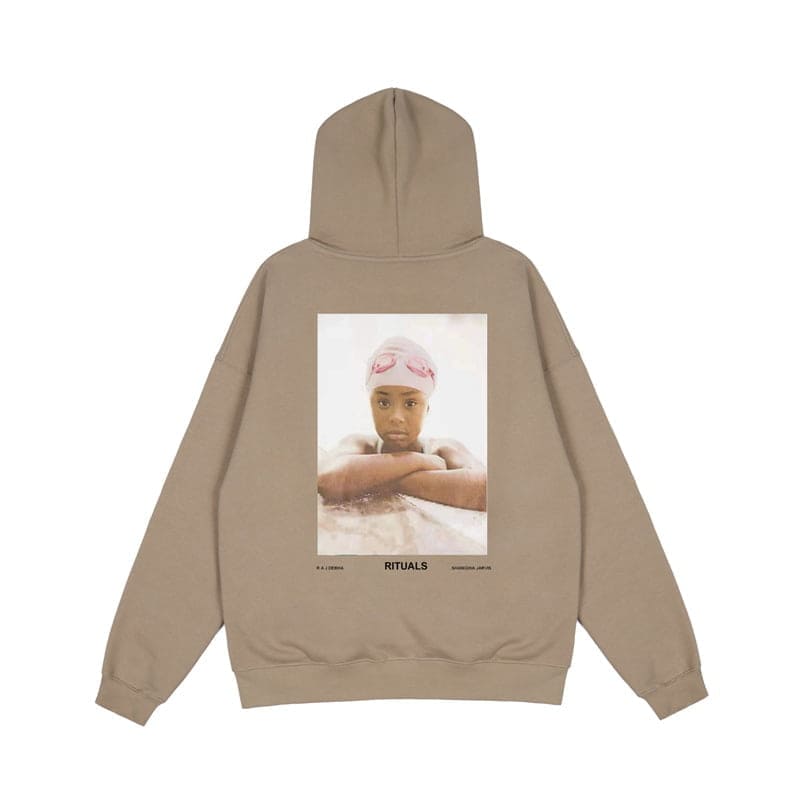 Rituals K-pop hoodie featuring a young girl with a pink headwrap, stylish and trendy, perfect for K-pop merchandise fans.