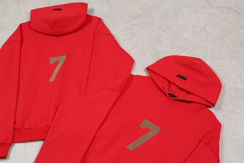 Red kpop hoodie and sweatshirt with the number 7, vibrant red color, casual streetwear style, perfect for fans, stylish and comfortable, showcasing popular merchandise for K-pop enthusiasts.