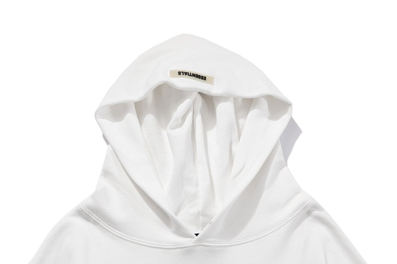White hoodie with "FEARLESS" tag at the neck, stylish K-pop merch item.