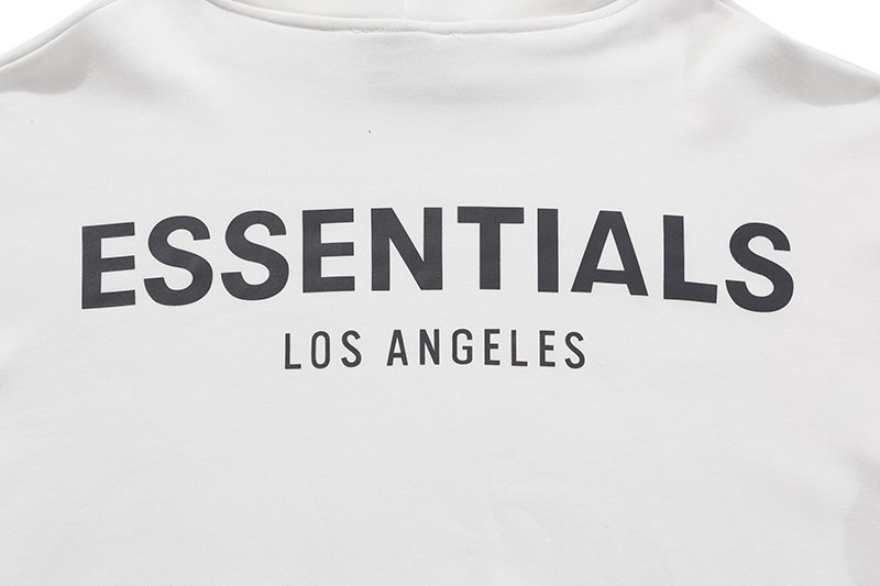 ESSENTIALS Los Angeles t-shirt with minimalist design and bold text, popular among K-pop fans for its trendy style and casual look.