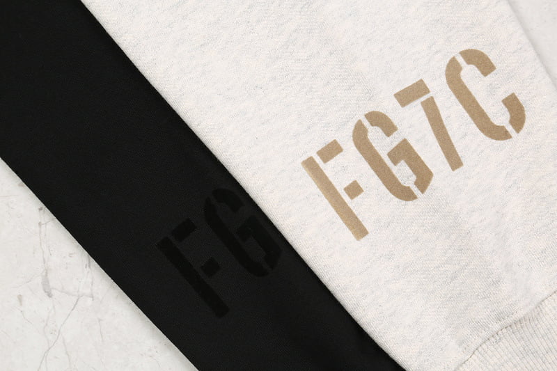 F-GIC logo on black and white fabric, likely K-pop merchandise or apparel, emphasizing stylish branding and design.