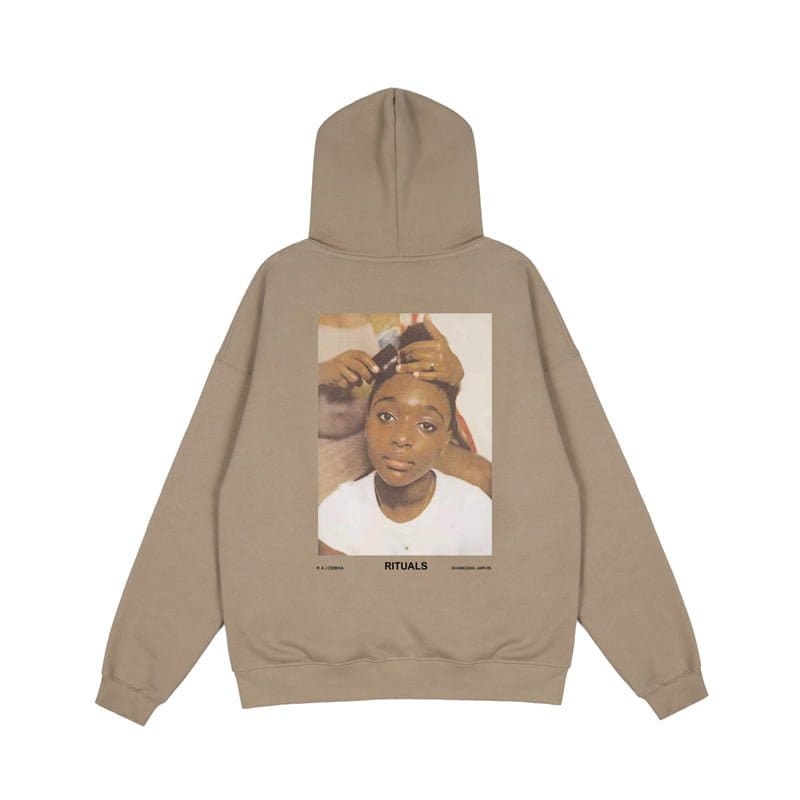 Hoodie with K-pop merchandise print featuring a young girl receiving a ritual haircut, beige color, oversized fit, casual streetwear style.