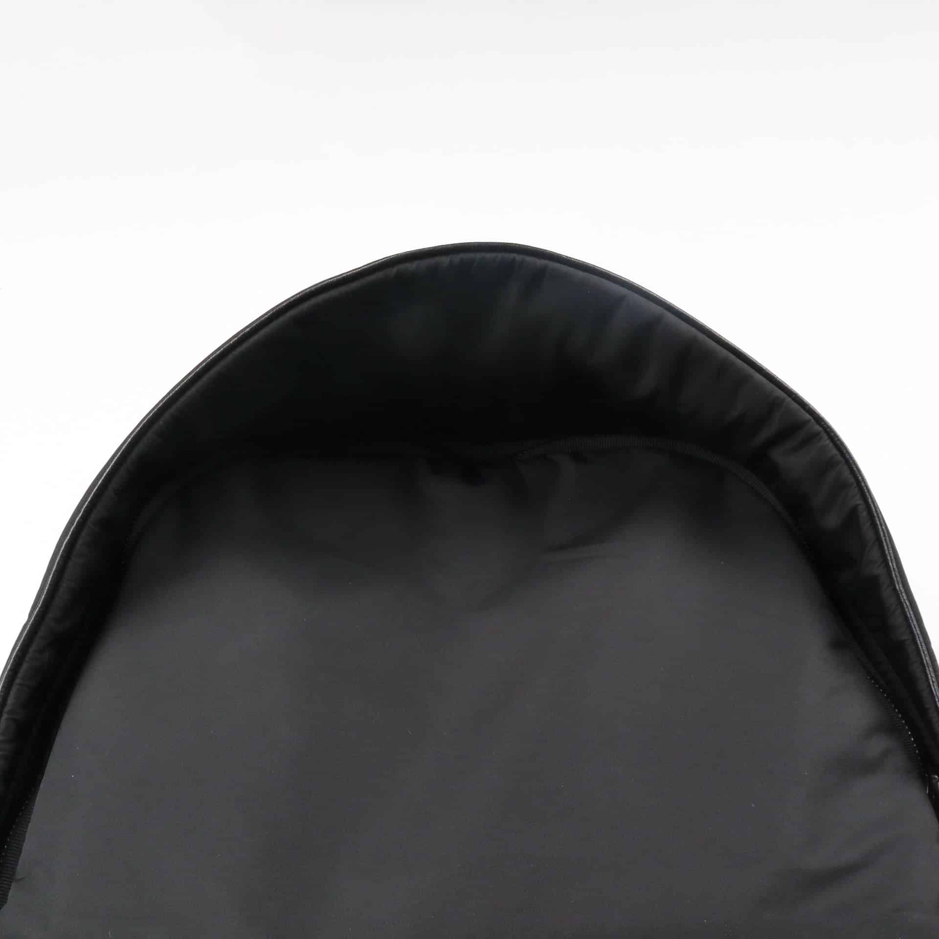 Her loop black leather backpack with minimal design for K-pop merch fans.