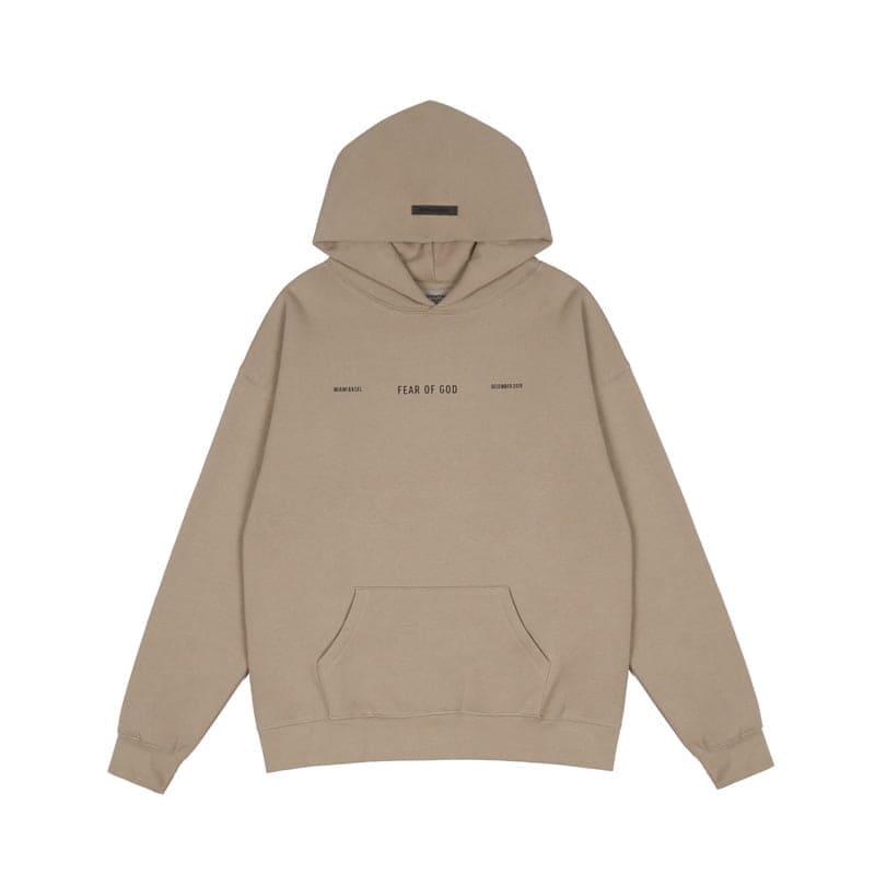 Fear of God beige hoodie with front pocket and minimalist text design, popular in K-pop merch themes.