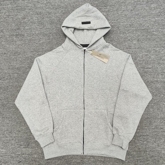 Gray zip-up hoodie with a front pocket and drawstring hood, featuring minimalistic design perfect for K-pop merchandise fans.