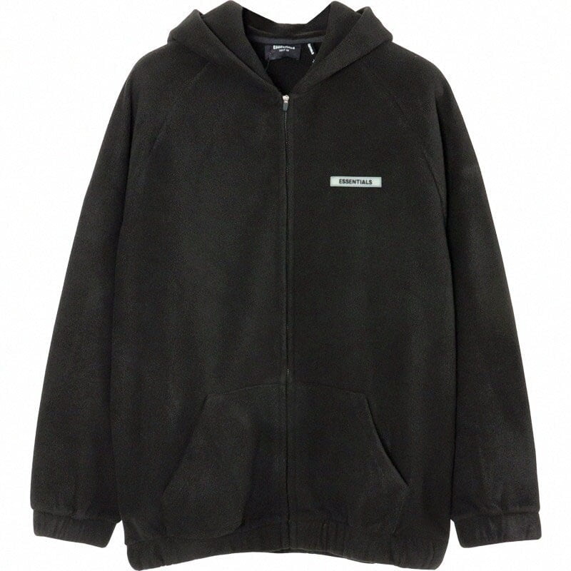 Black hoodie with "ESSENTIALS" logo, oversized fit, casual streetwear, unisex, cozy fleece material, zipped front, hood with drawstrings, front kangaroo pocket, popular among K-pop fans, versatile everyday style.
