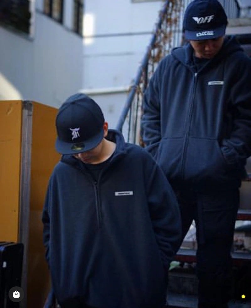 Black hoodie and cap with minimalist text design, casual streetwear style for K-pop fans.