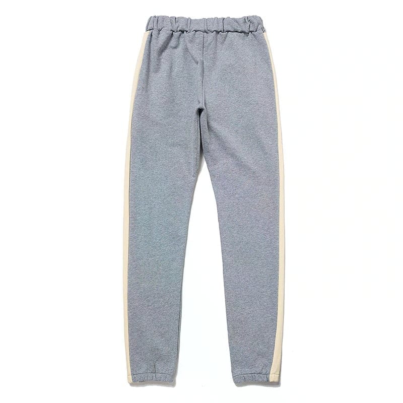 Grey jogger pants with white side stripes for casual wear and loungewear, comfortable elastic waistband, soft fabric, versatile style for everyday outfits, unisex fit.