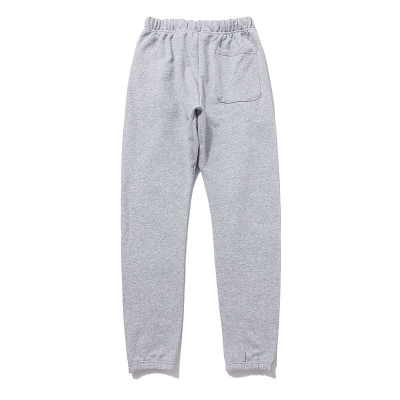 Grey sweatpants with pocket for casual wear, suitable for during workouts or lounging at home.