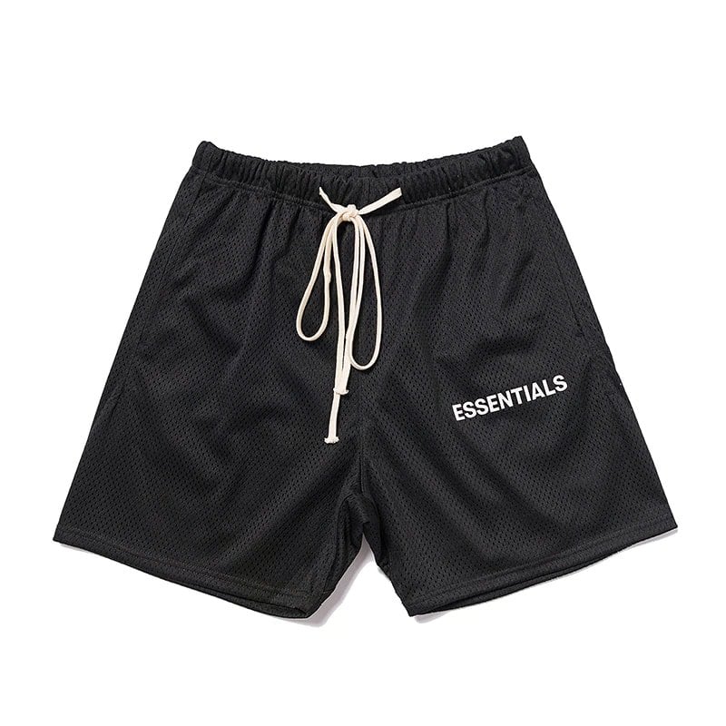 Black mesh shorts with "ESSENTIALS" logo, drawstring waist, casual kpop merch, comfortable sporty style for fans of Korean pop culture.