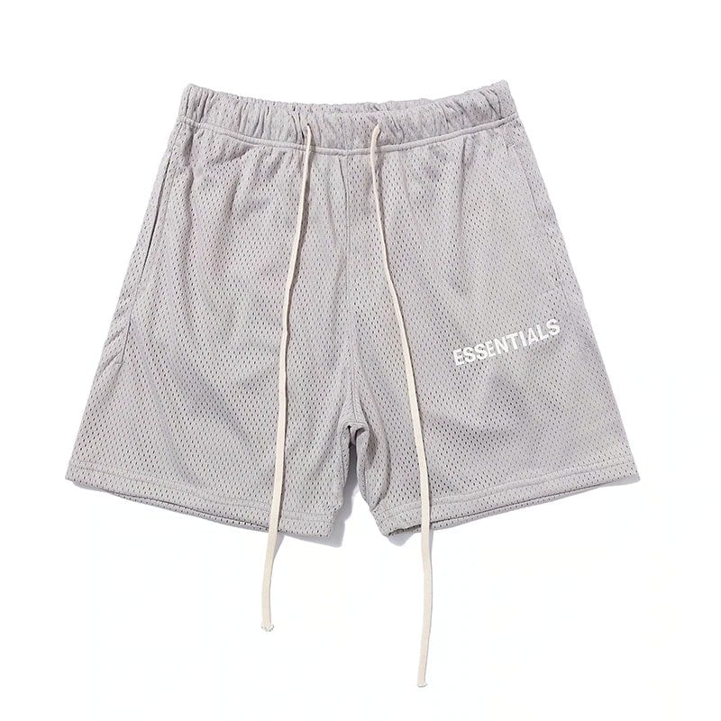 Kpop merch, lightweight gray mesh shorts with "ESSENTIALS" printed on the side, featuring an adjustable drawstring and comfortable fit, perfect for casual or sporty outfits.