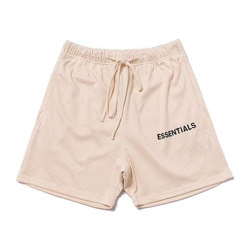 - Mesh beige shorts with "ESSENTIALS" print, drawstring waist, perfect for casual K-pop style outfits.