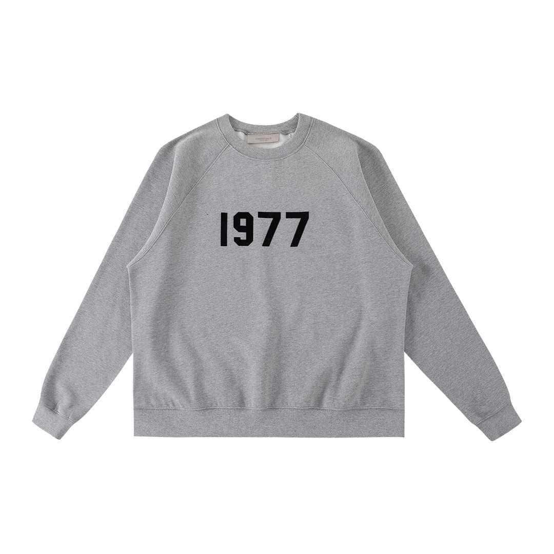 1977 gray sweatshirt with bold black year print, perfect for K-pop merch fans and casual wear.