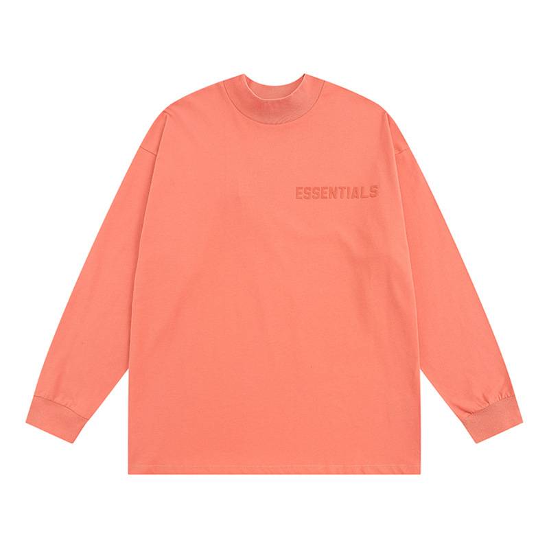 ESSENTIALS oversized coral sweatshirt, soft cotton material perfect for K-pop fans, with minimalistic design and subtle logo detail. An ideal addition to any K-pop merch collection.