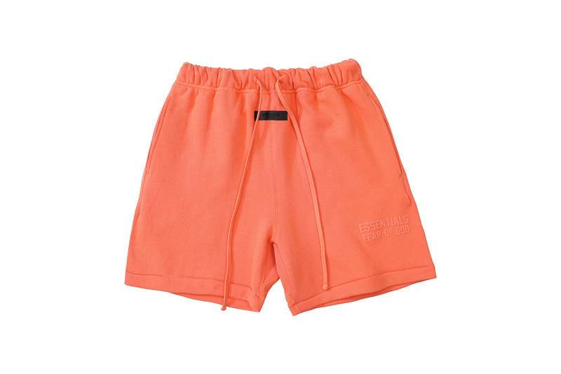 Casual coral orange K-pop merchandise shorts with drawstring and embroidered text, unisex style, trendy youth streetwear.