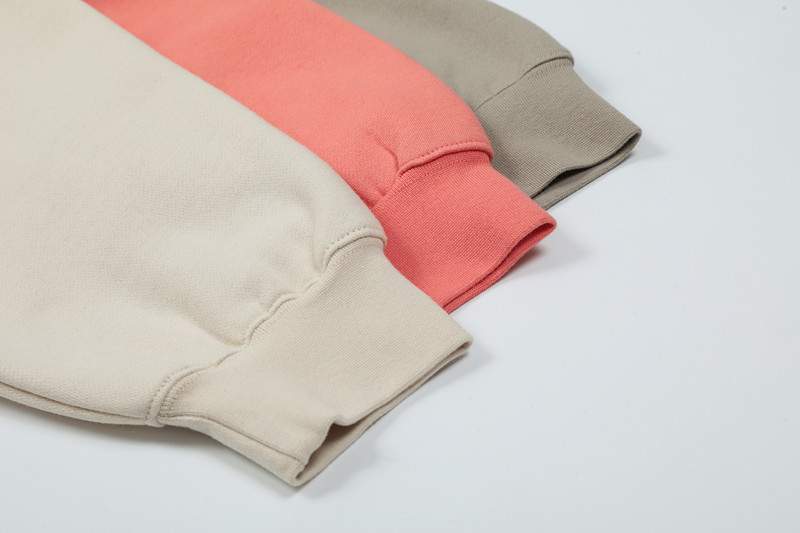 Soft pastel-colored K-pop merchandise sweatshirts, casual streetwear for fans, cozy and stylish appeal, popular among K-pop enthusiasts, comfortable apparel with vibrant colors.