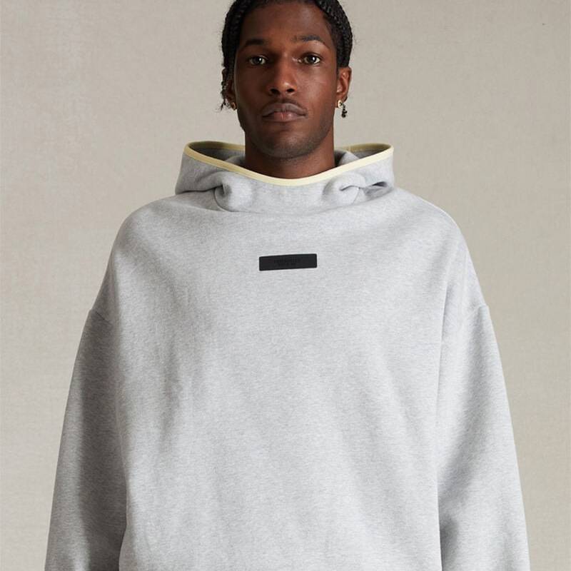 Comfy oversized hoodie with subtle black graphic, versatile for everyday wear.