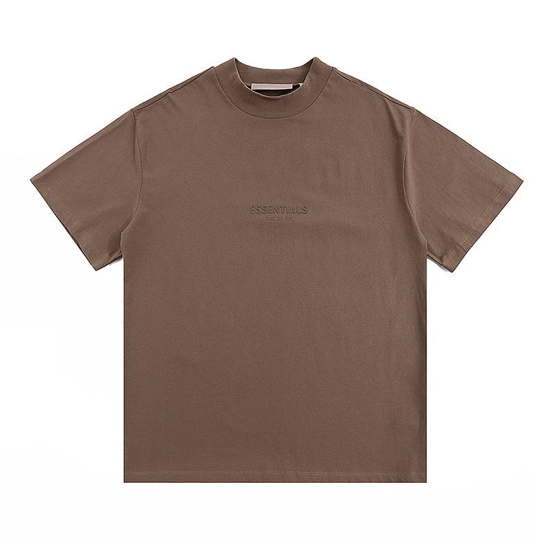 Essential Essentials T-shirt in earthy brown, featuring minimalist text design, perfect for casual K-pop merch fans. The shirt has a relaxed fit and is ideal for everyday wear or concert outings.