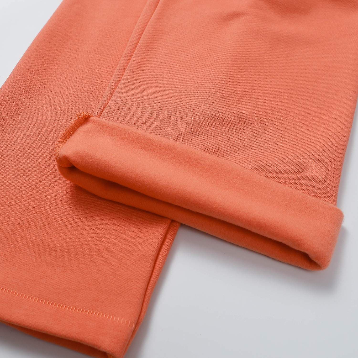 Orange oversized hoodie, soft fleece interior, casual streetwear style, cozy everyday wear, trendy fashion sweatshirt for women and men.