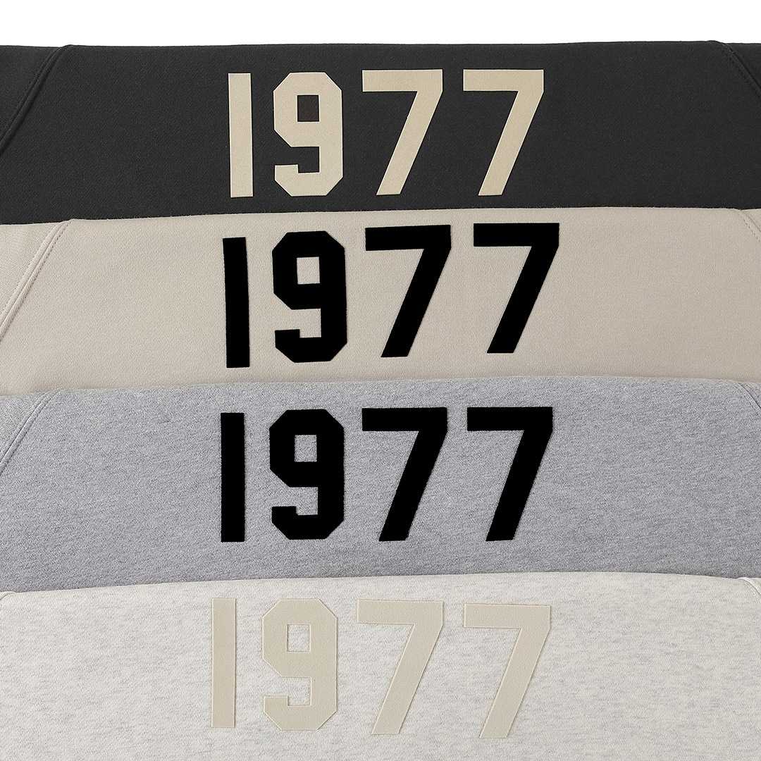 1977 black and white hoodie sweatshirt, retro style K-pop merchandise, casual comfortable streetwear for fans.