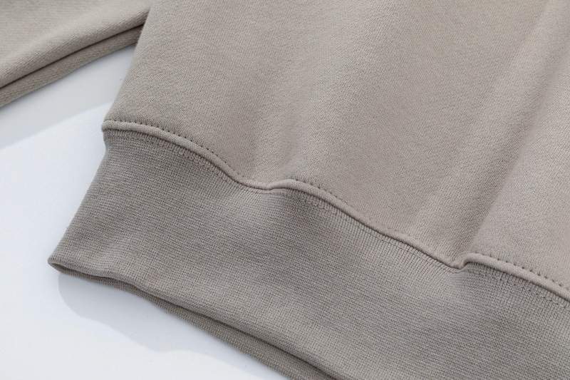 Comfy beige kpop merch hoodie with soft fabric and ribbed cuffs for fans.