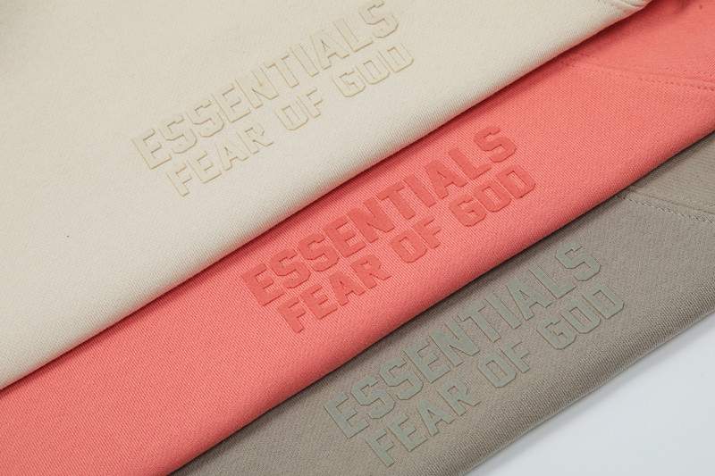 Essentials fear of god kpop merch sweatshirt, minimalistic design, embossed text, neutral and pastel color options, trendy fashion, popular among K-pop fans, high-quality fabric, casual streetwear style, unisex clothing perfect for fans, stylish and comfortable.