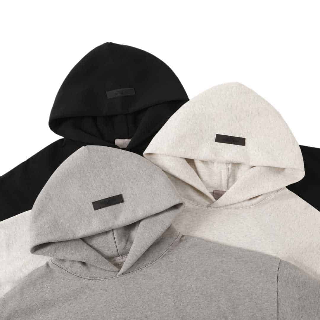Hoodie with black label, black, white, and grey hooded sweatshirts, casual urban fashion, unisex style, minimalist design.