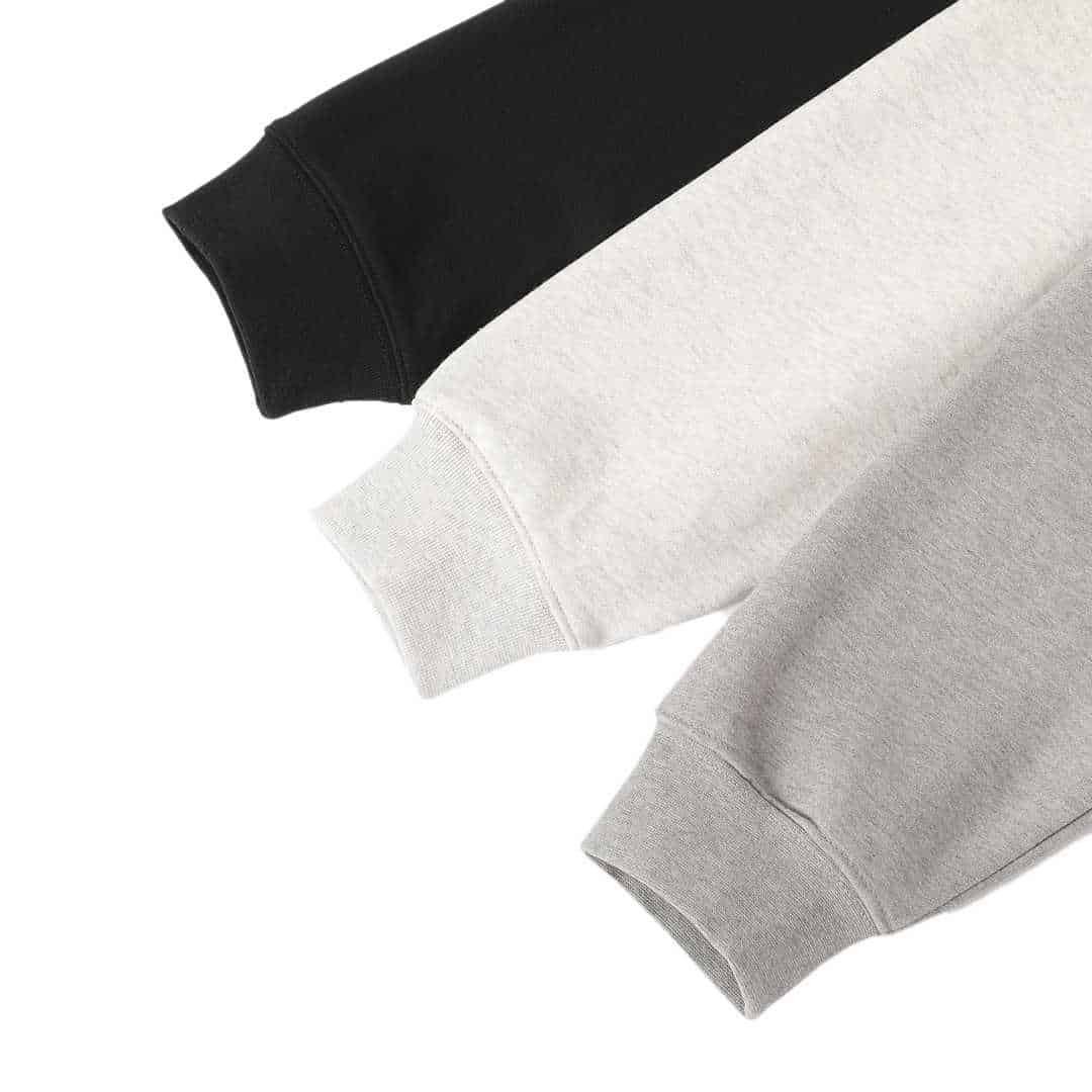 Black and white sweatshirt with "twice" printed on the sleeves.