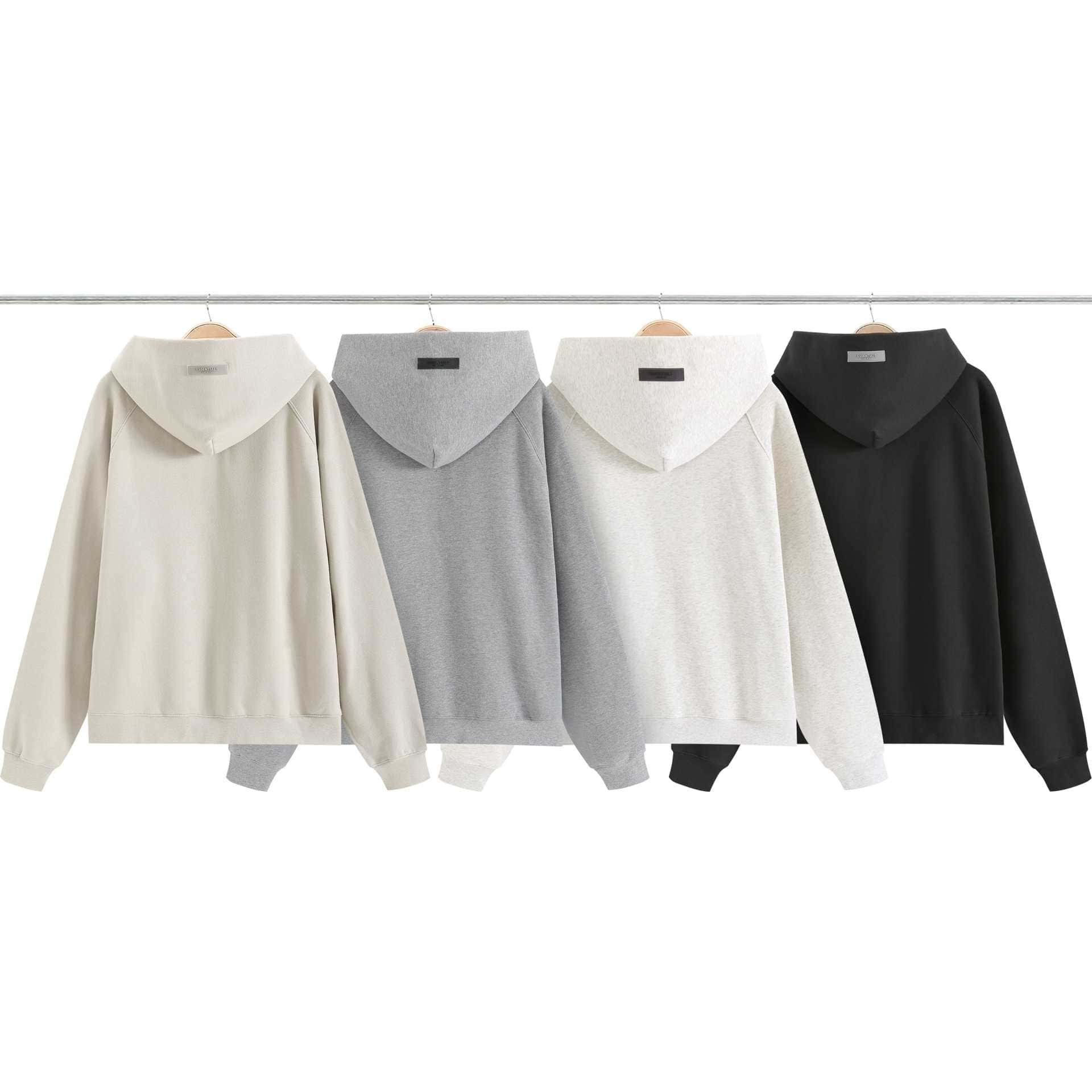 Crewnecks with hoodies in neutral tones, hanging on a clothes rack, showcasing minimalist and versatile fashion pieces. Perfect for casual streetwear and everyday style, suitable for K-pop fans and fashion enthusiasts.