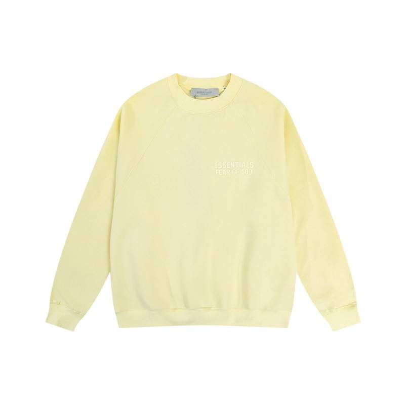 Crewneck sweatshirt with "Essentials Fear of God" branding, in pastel yellow, showcasing minimalist K-pop-inspired fashion for fans of trendy merch.