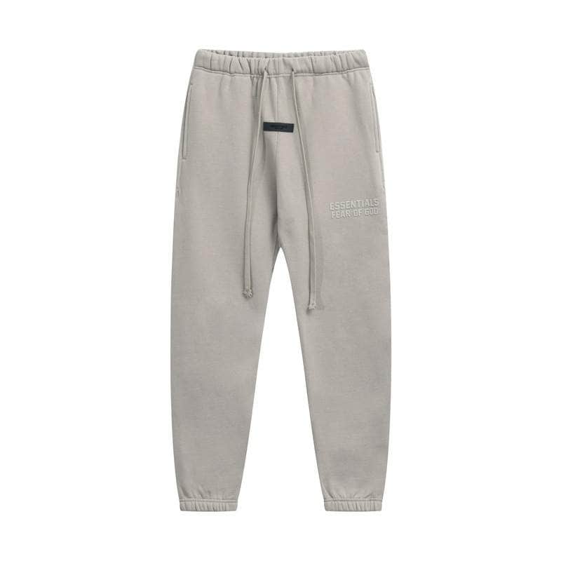 Fancy grey joggers with drawstring waistband and embossed logo, perfect for casual wear and K-pop merch fans.