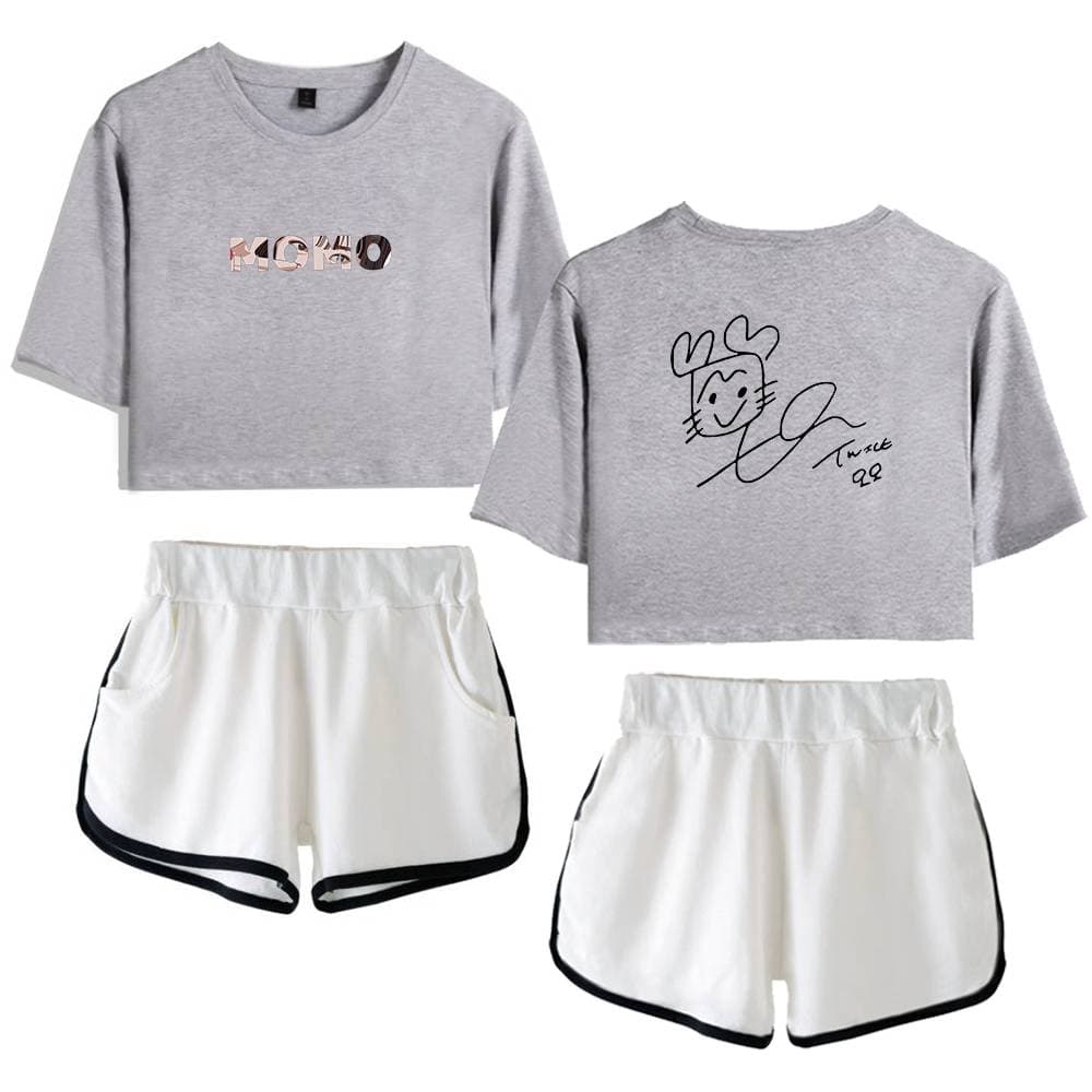 Kpop merch, two matching grey cropped T-shirts with graphic designs and white shorts with black trim perfect for K-pop fashion fans.