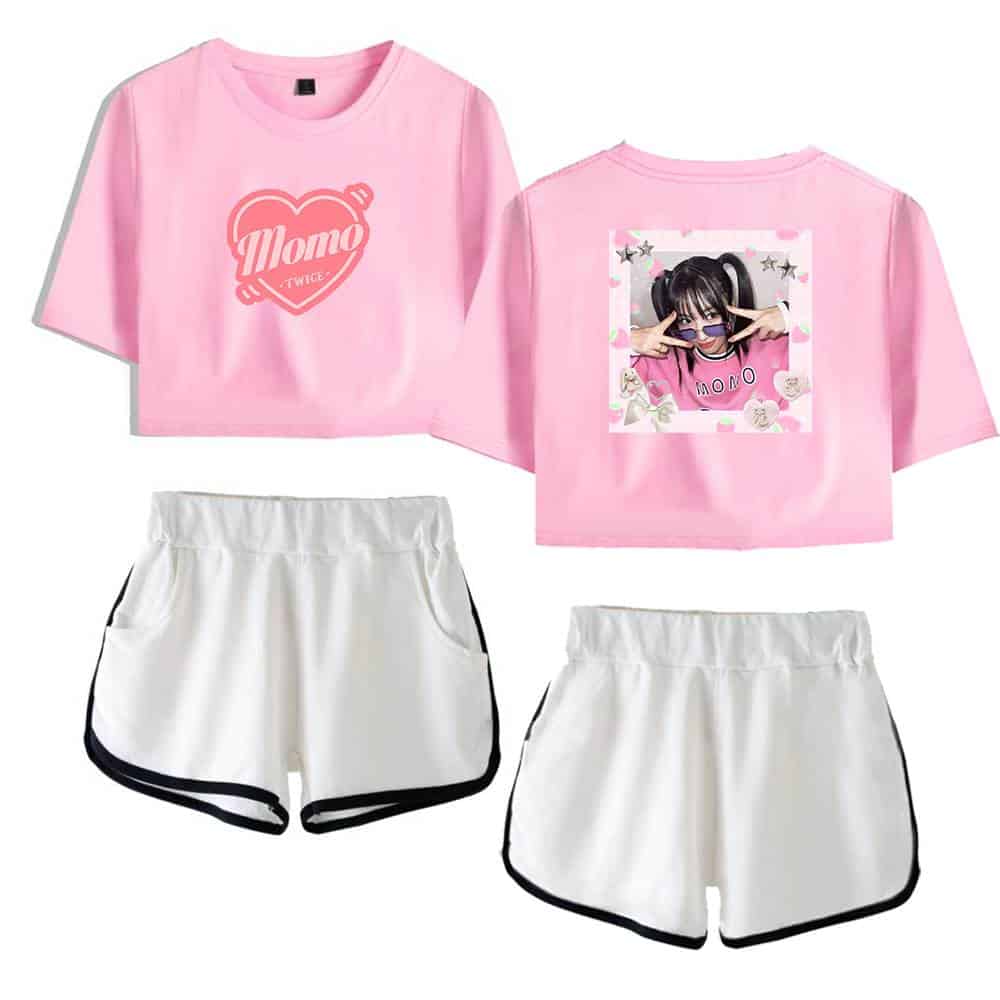 Pink K-pop merchandise set featuring a pink graphic crop top with "Momo TWICE" design and a matching photo print crop top, paired with white athletic shorts with black trim.