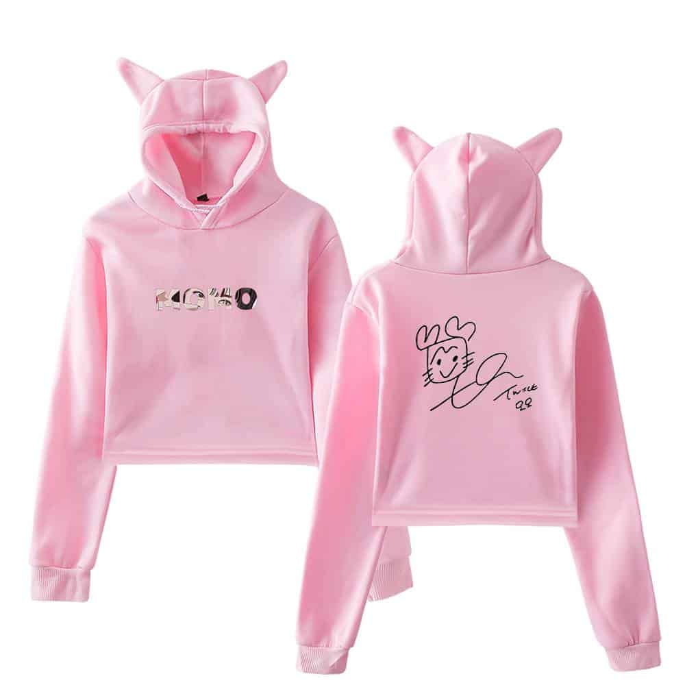 Pink kpop hoodie with playful cartoon and brand logo design, adorable and trendy, perfect for fans of TWICE's merchandise collection.