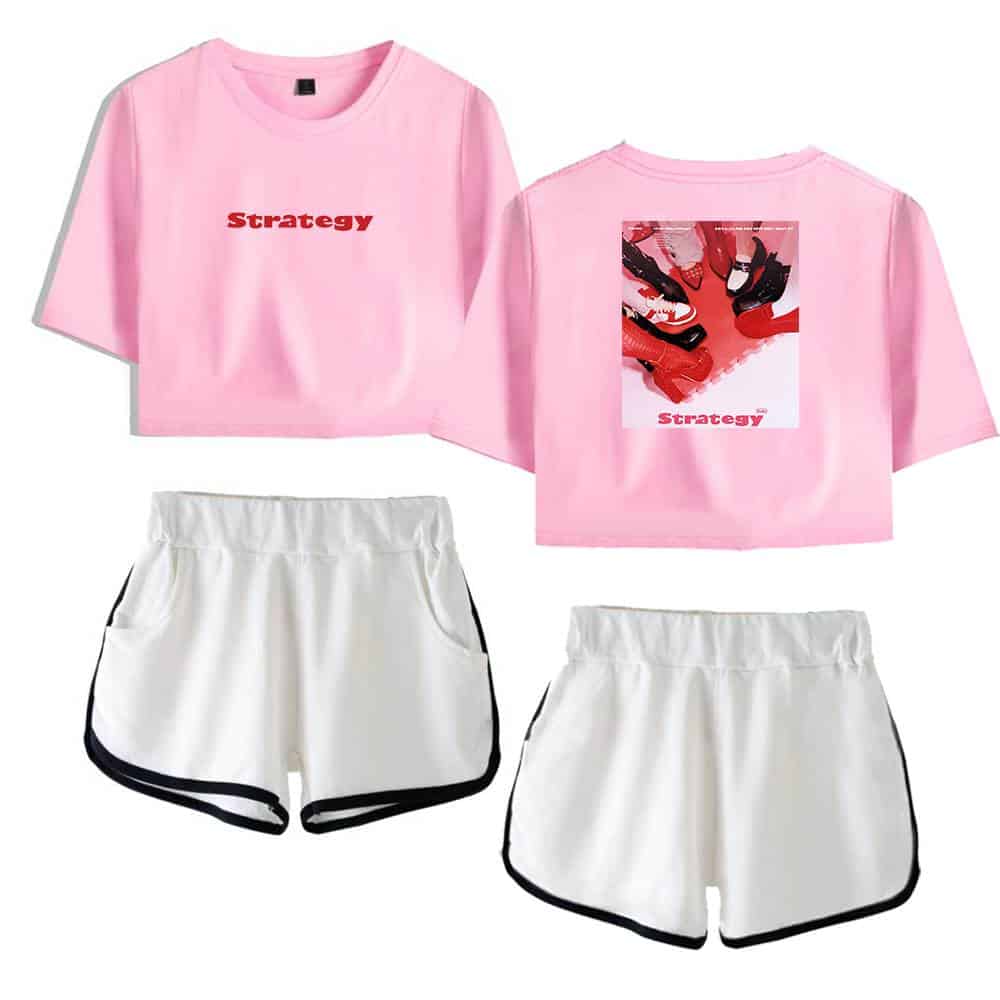 Pink kpop merch, oversized pink t-shirt with red "Strategy" text and graphic back design, paired with white sporty shorts with black trim, stylish casual K-pop inspired outfit for fans.