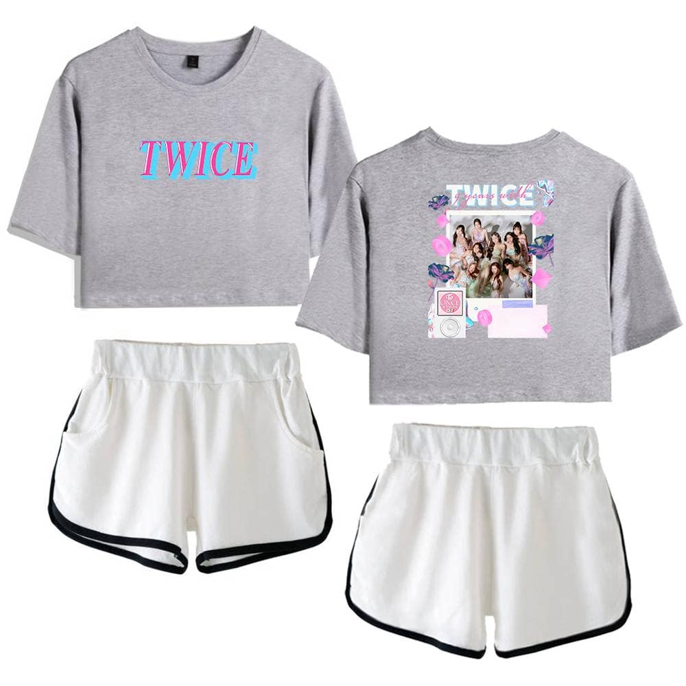 TWICE K-pop merchandise, featuring cropped t-shirts and stylish shorts, perfect for fans to showcase their support with bold logos and vibrant group photos. Ideal for casual wear or fan events.