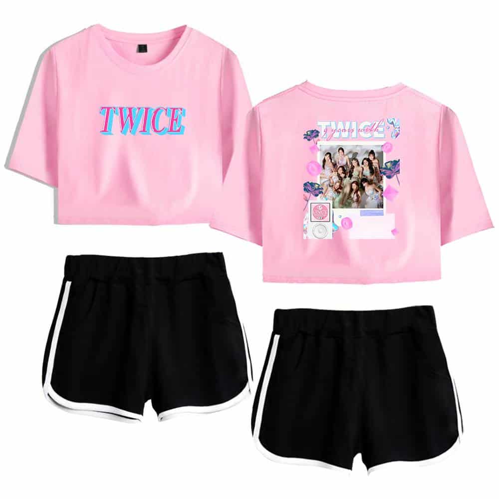 TWICE Kpop merchandise, pink graphic crop top and black athletic shorts set for fans, featuring TWICE logo, group photo print, and stylish casual wear for Kpop enthusiasts.